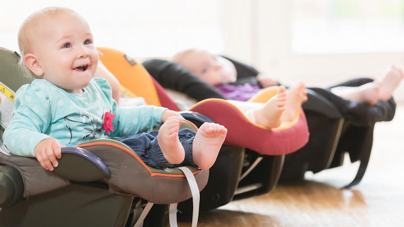 New-born babies in toddler group lying in baby shells