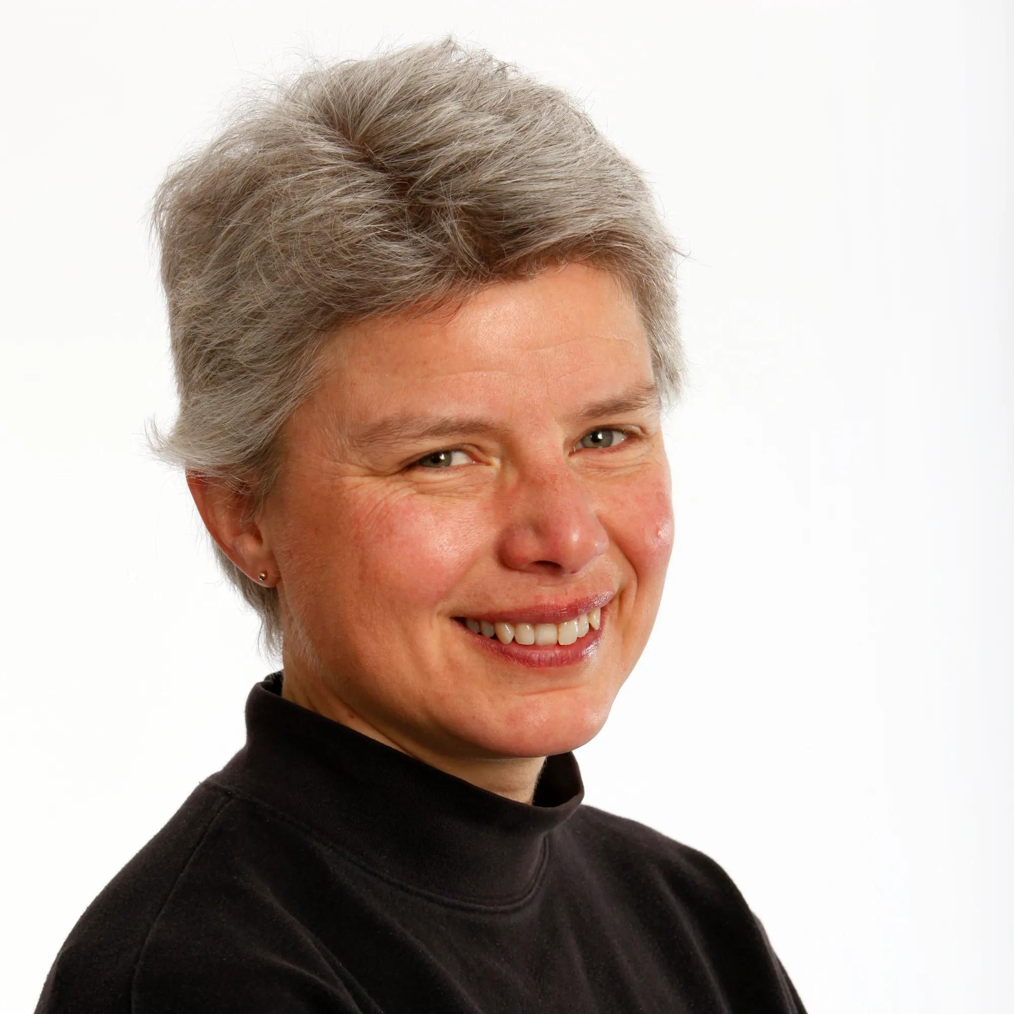 PREFERRED Formal portrait of Carol Bult against a white background  