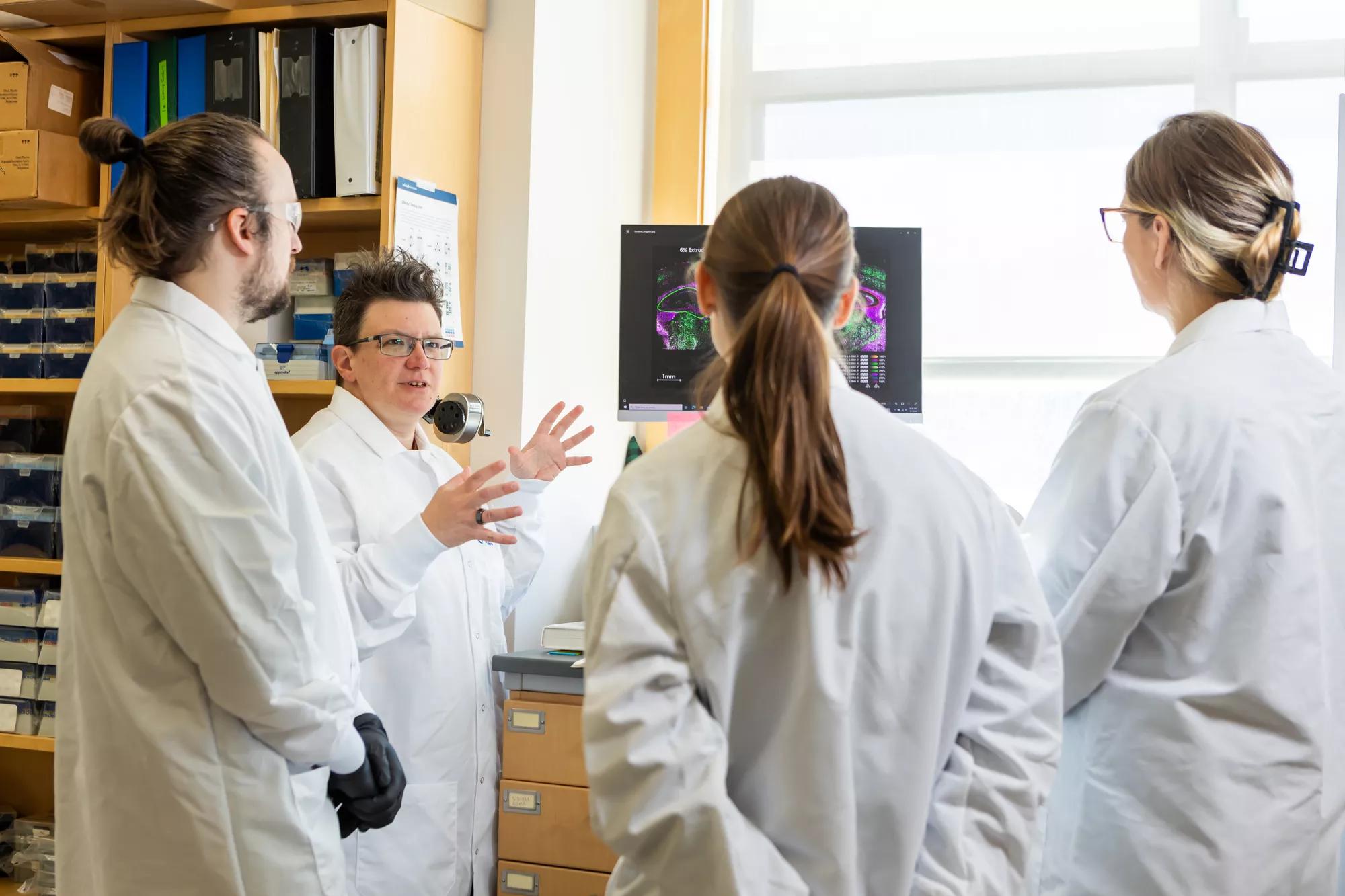 Kristen O'Connell, Ph.D. (second from the left) and her team in their lab.