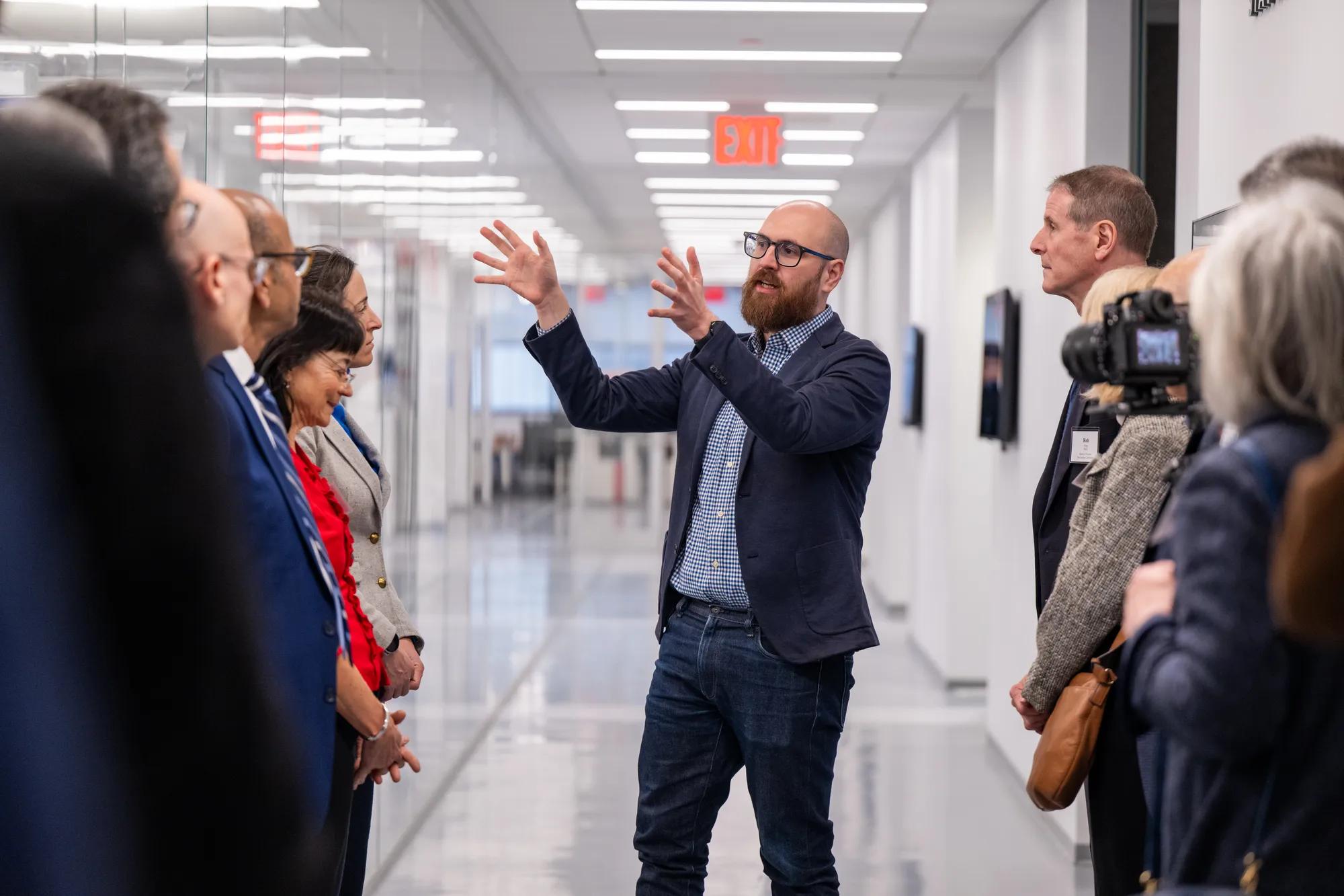 Daniel Paull, vice president of discovery & platform development at JAX, leading a tour of the NYSCF facility.